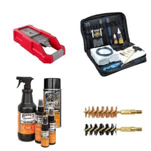 Essential weapon cleaning supplies including brushes, sprays, and a cleaning kit for firearm maintenance excellence.