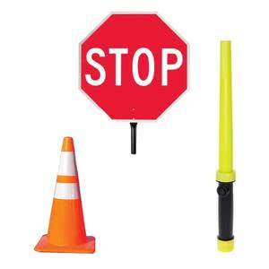 Image displaying a stop sign, traffic cone, and signaling baton for traffic management and safety.