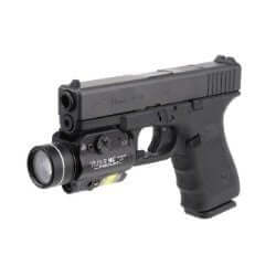 Compact handgun with weapon-mounted light, ideal for tactical use by law enforcement and military personnel.