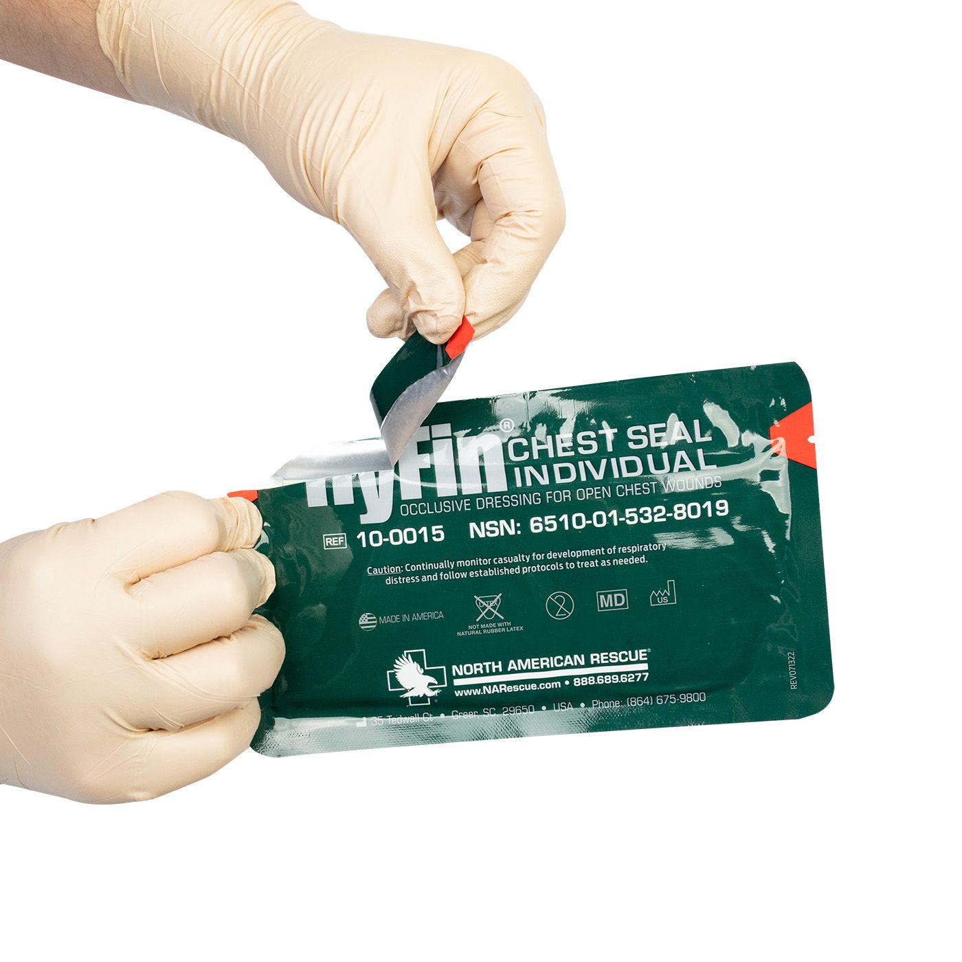 Person opening a green myFill chest seal package with a white background