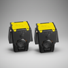 Two black and yellow Taser cartridges with a Taser logo on a gray background