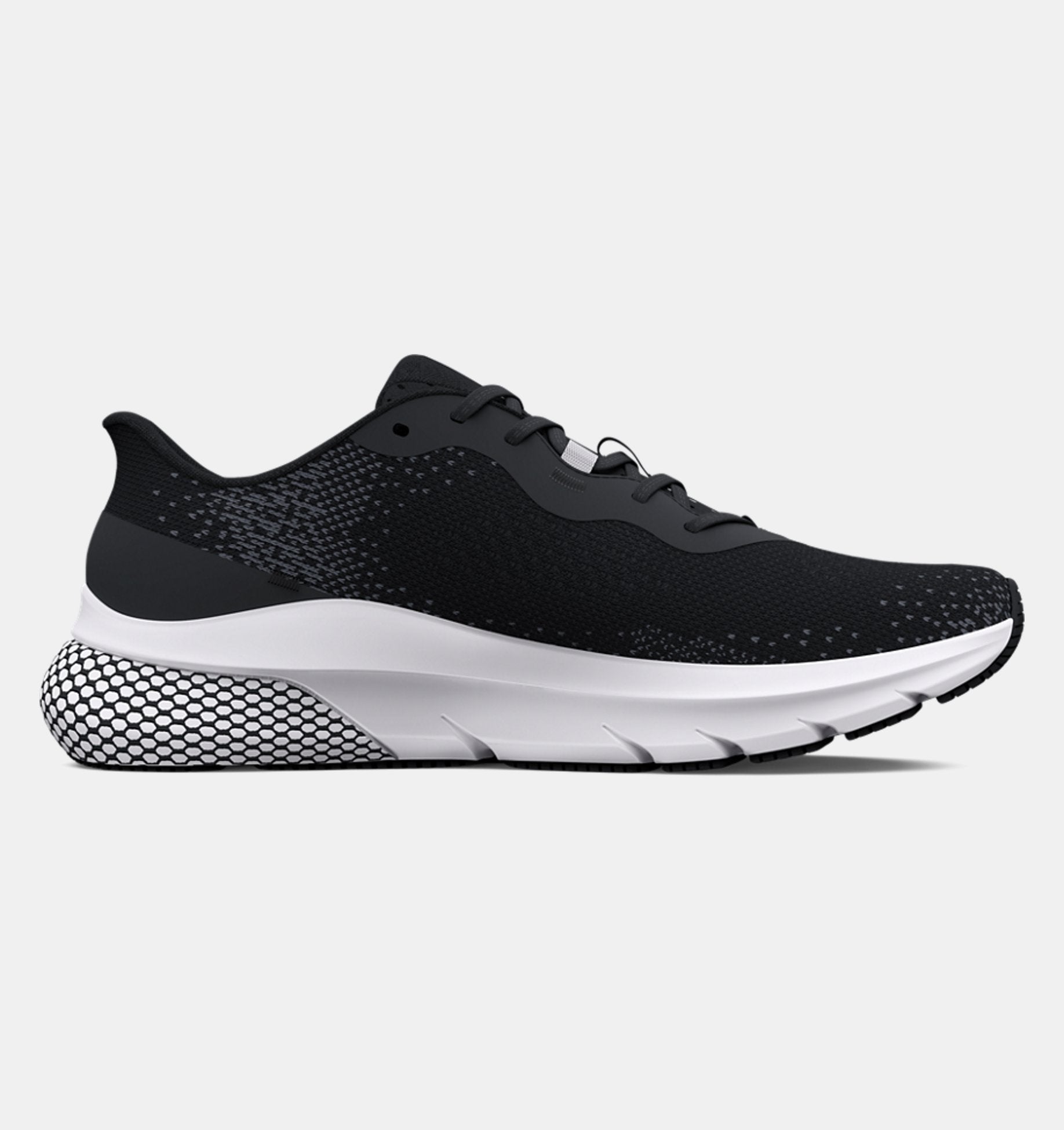 Black running shoe with white sole on a light gray background