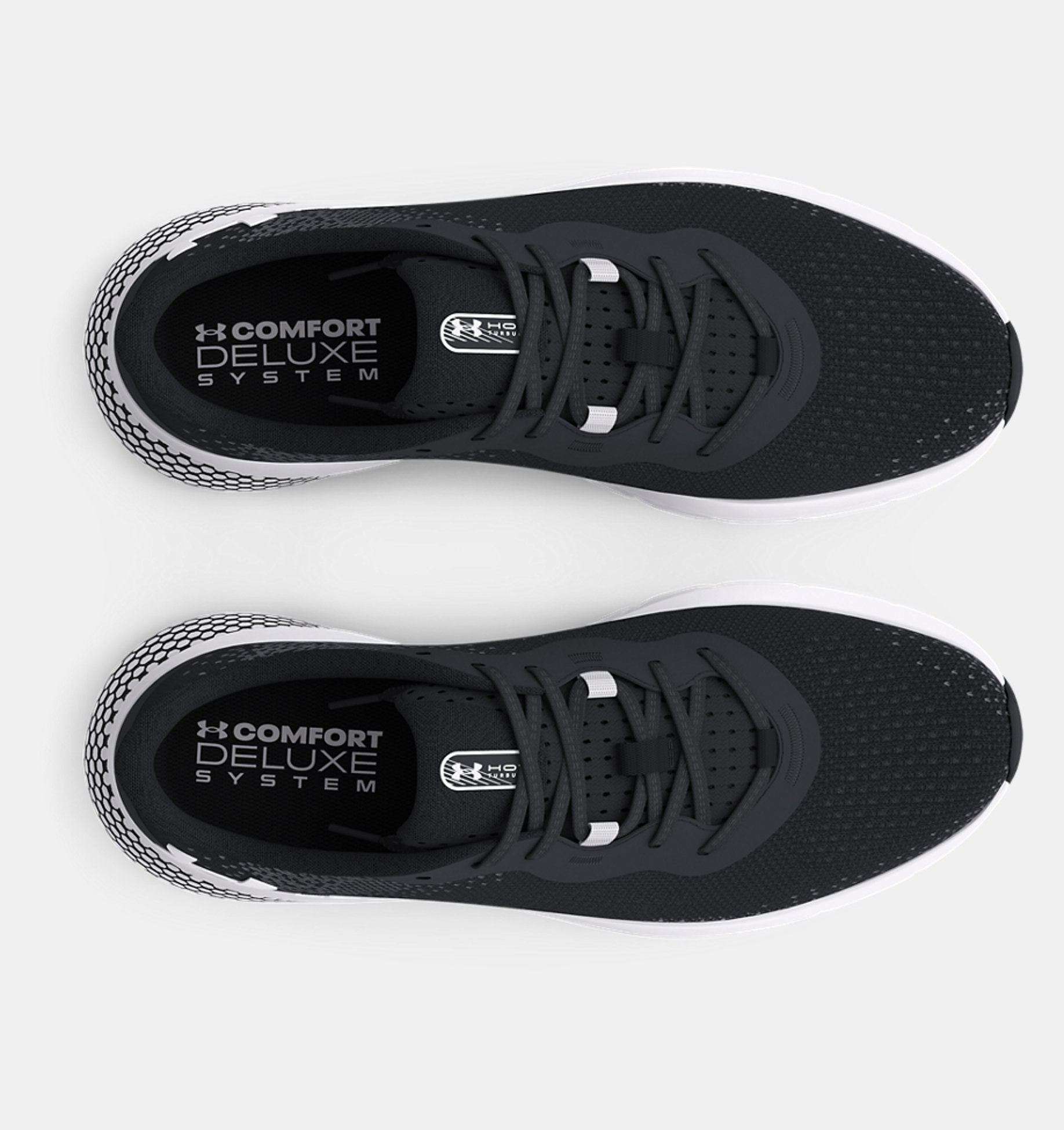 Black athletic shoes with 'Comfort Deluxe System' label on a white background