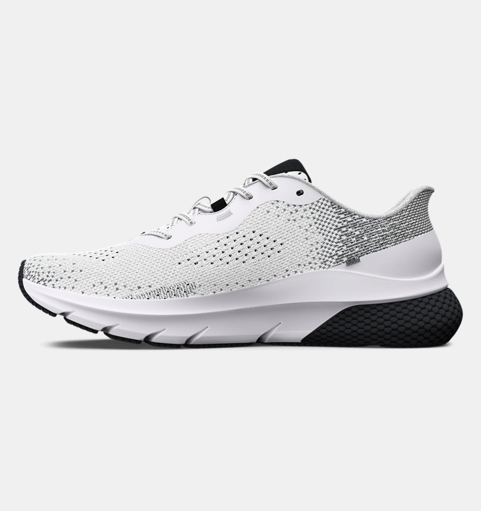 White running shoe with black sole on a light gray background