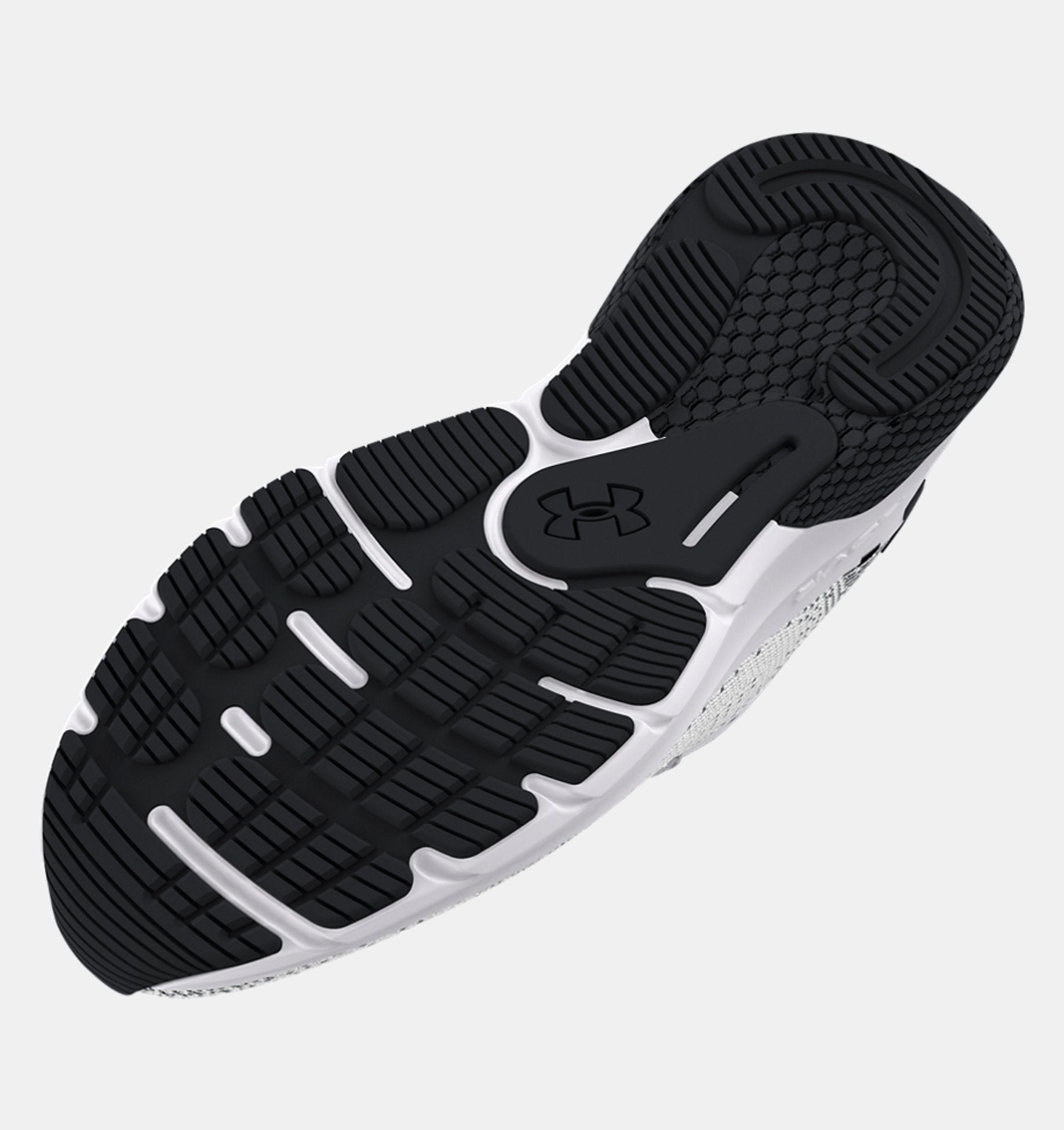 Black and white running shoe with an Under Armour brand logo on a light gray background