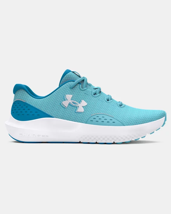 Under Armour UA W Charged Surge 4 women's running shoes in blue, featuring breathable mesh upper and Charged Cushioning midsole.