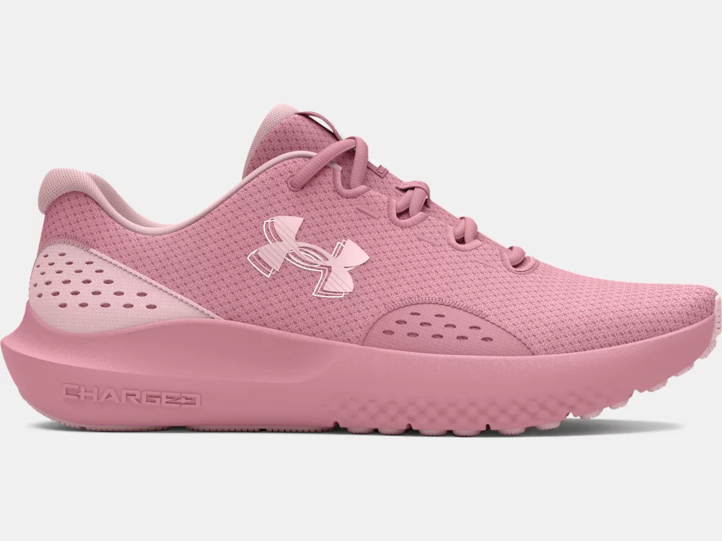 Under Armour UA W Charged Surge 4 women's running shoes in pink, featuring breathable mesh and enhanced cushioning for comfort.