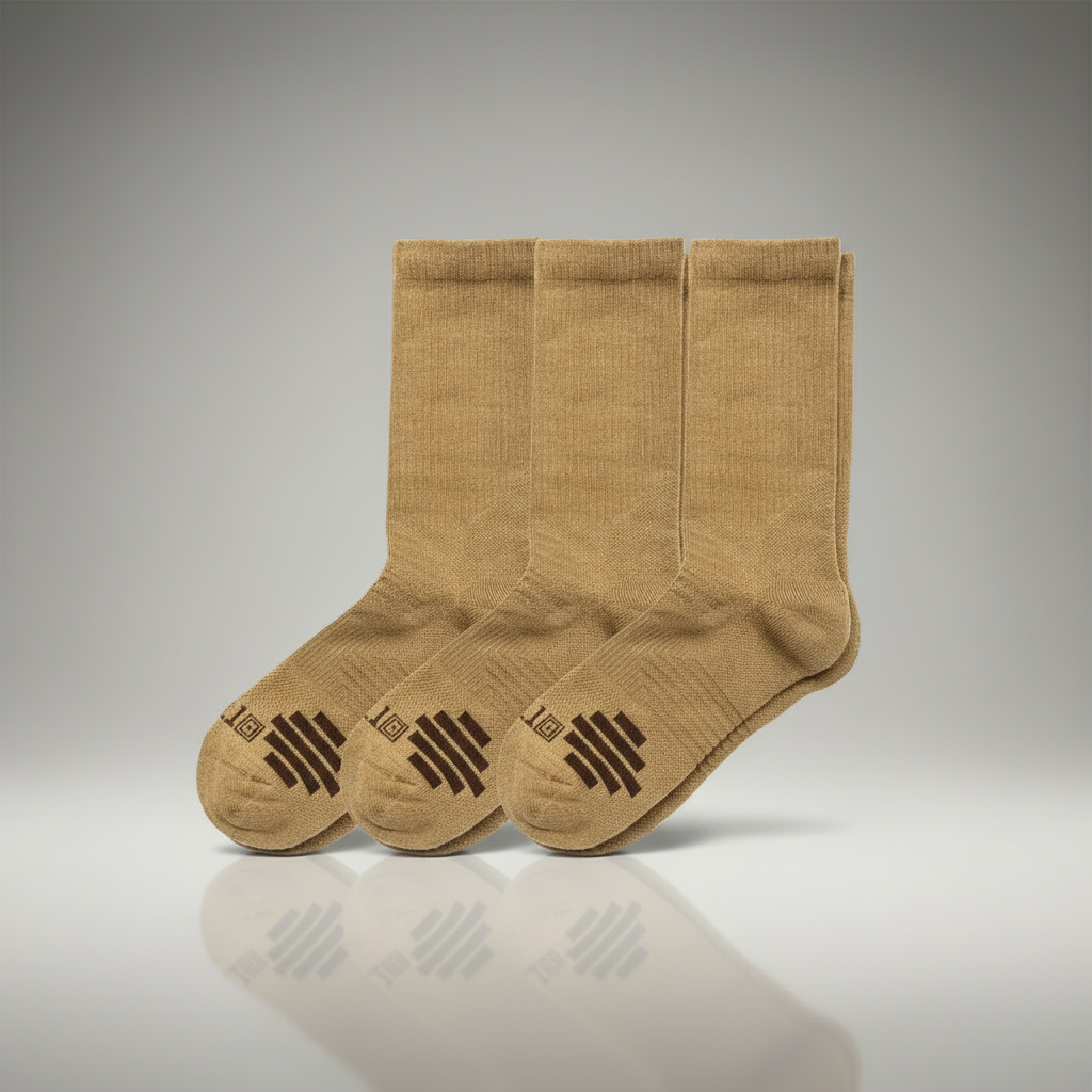 Three pairs of tan socks on a gray background