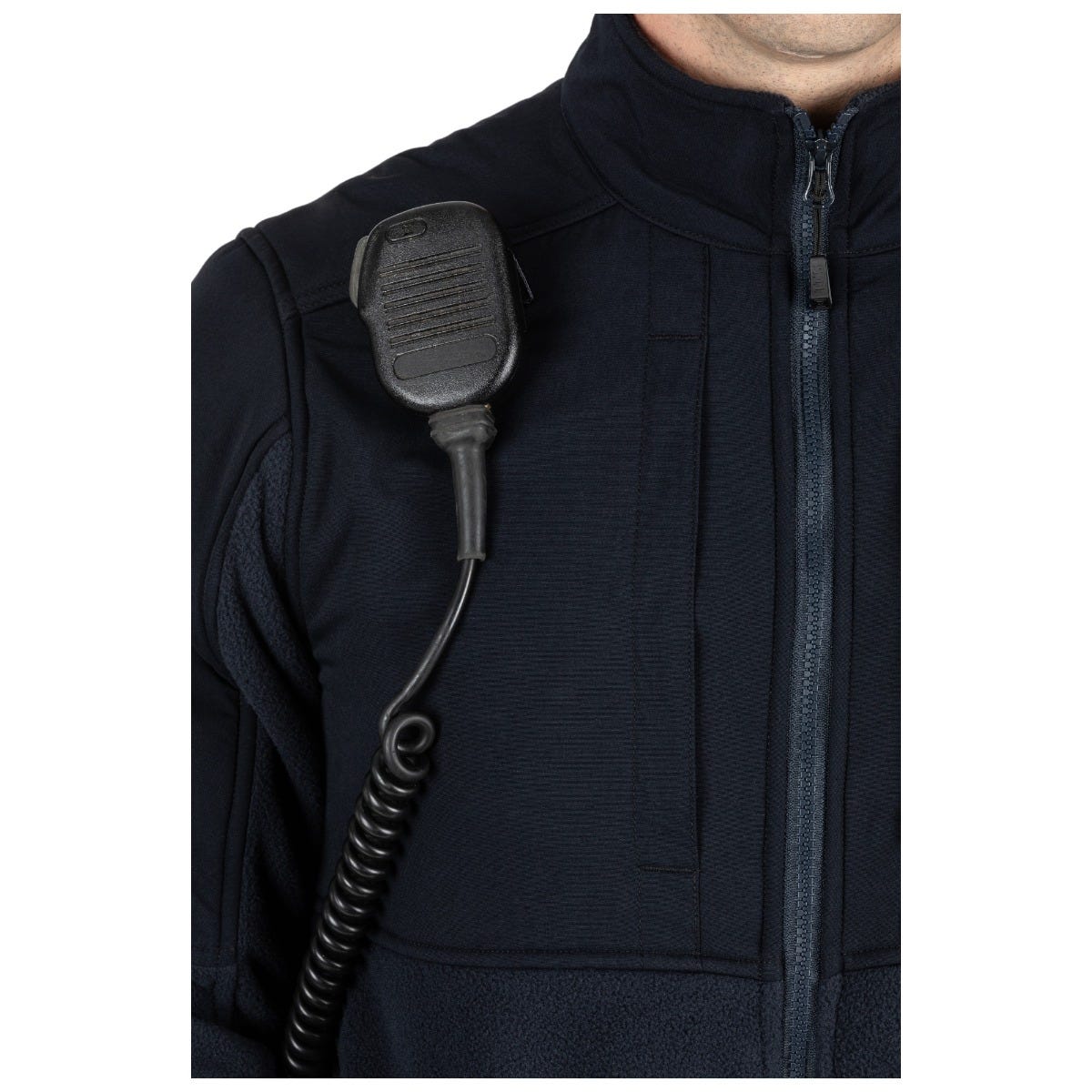 Black communication device attached to a person wearing a black jacket on a white background