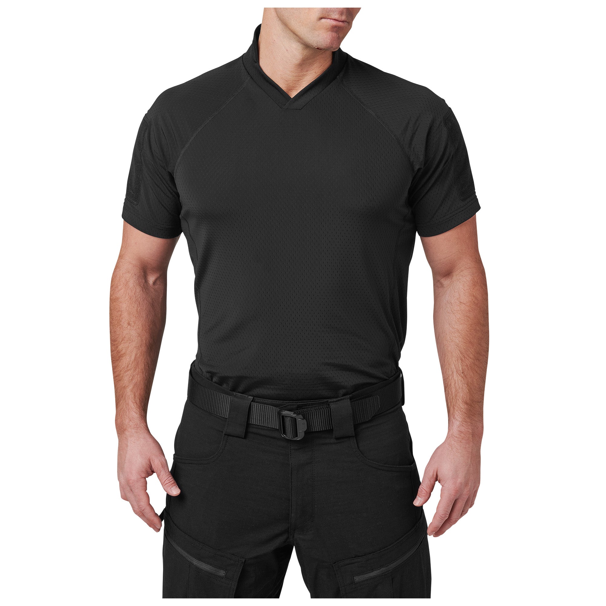 Person wearing a black V-neck shirt and pants on a white background