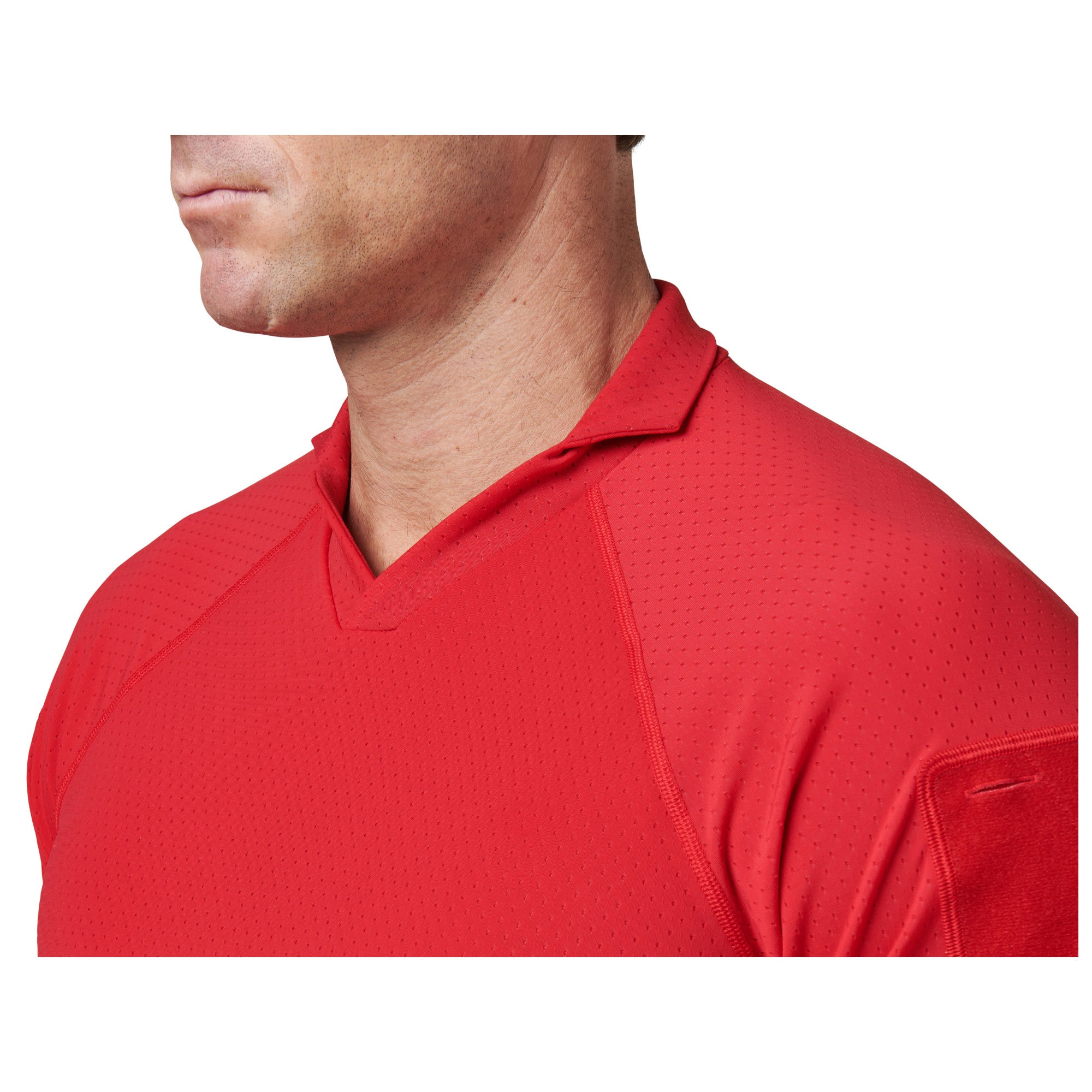 Red athletic shirt worn by a person on a white background
