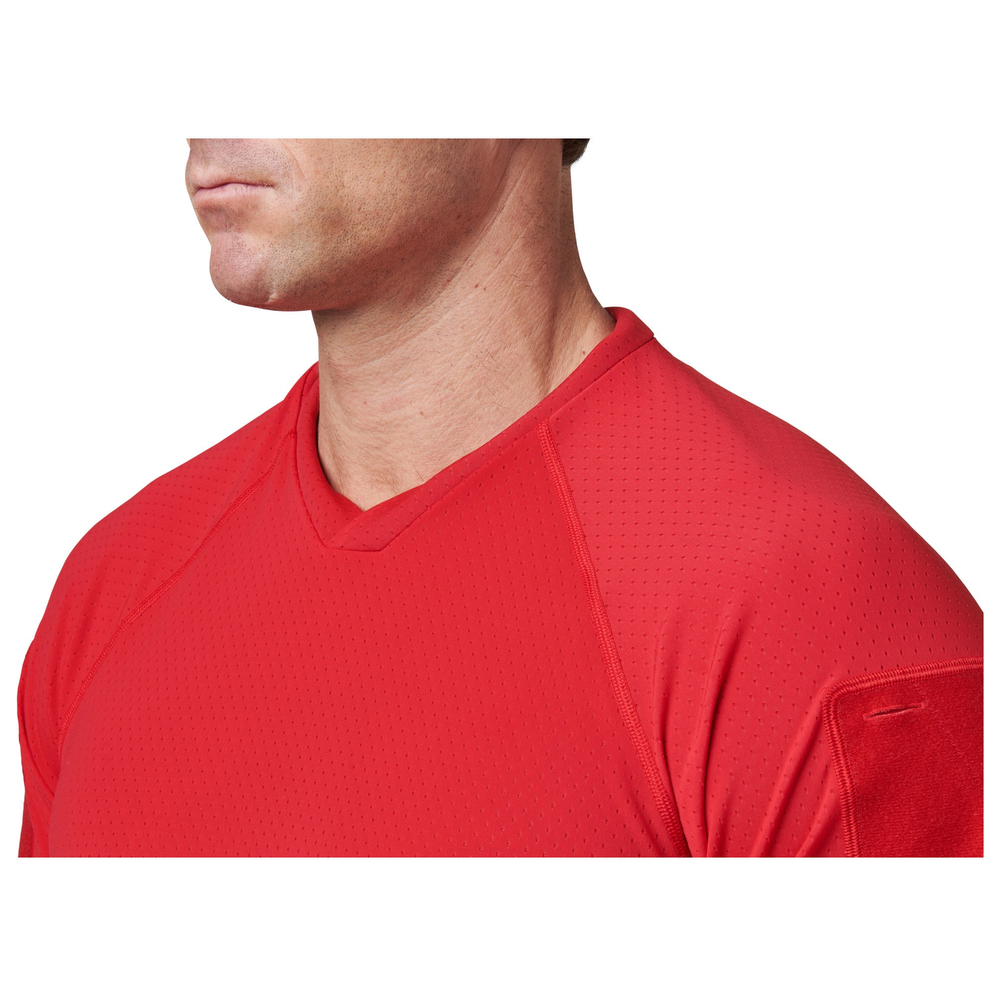 Red athletic shirt worn by a person on a white background