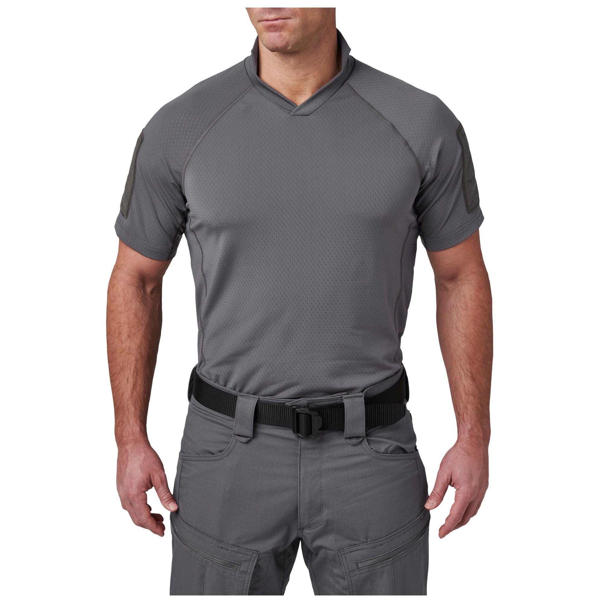Person wearing a gray short-sleeve shirt and pants on a white background