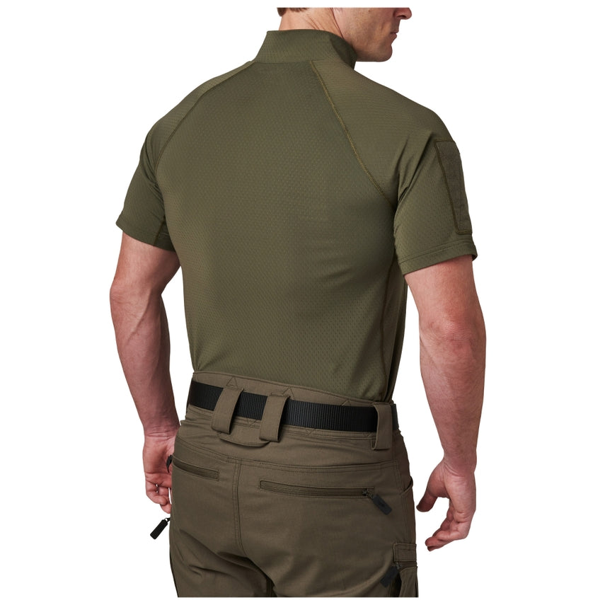 Person wearing an olive green tactical shirt and pants on a white background