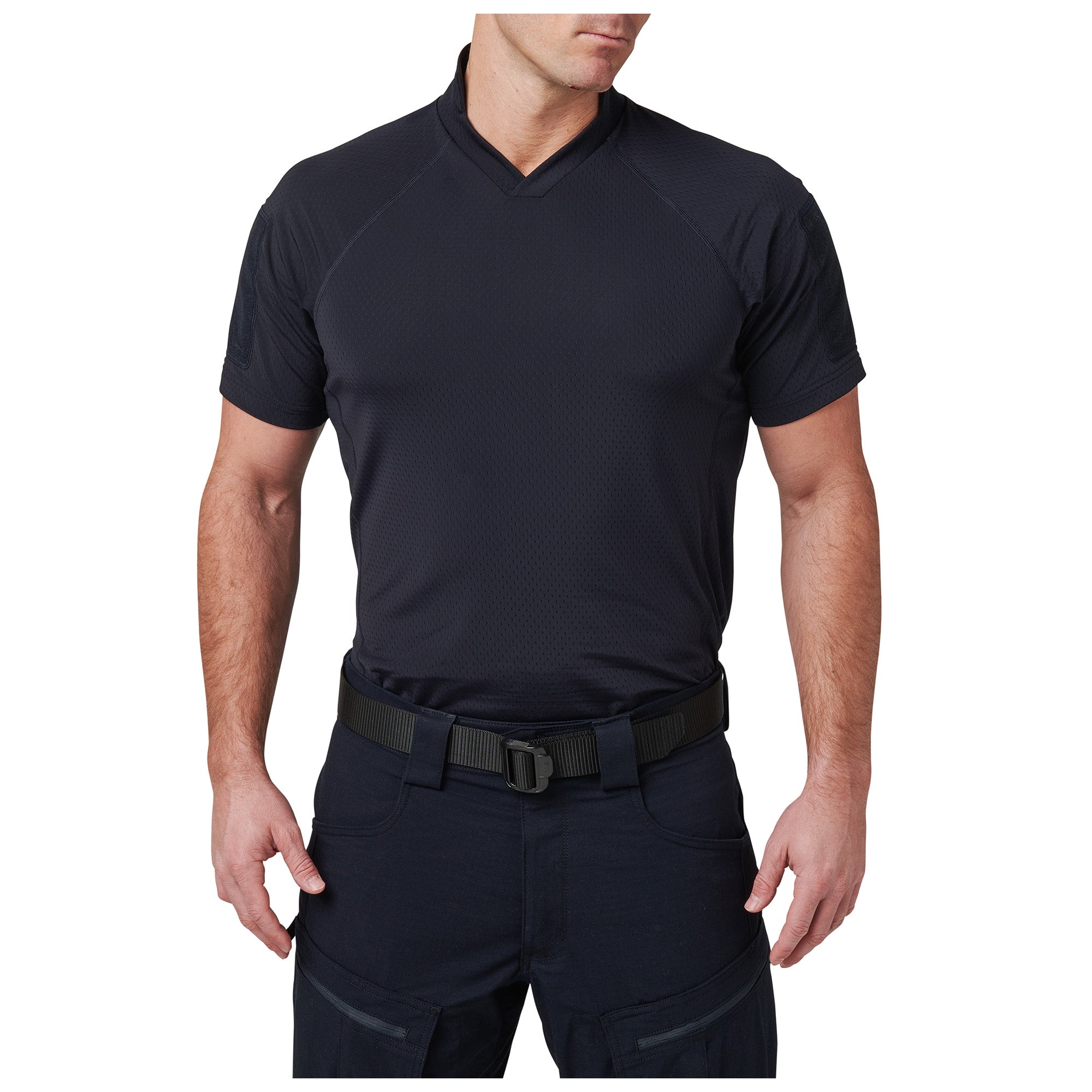 Person wearing a black V-neck shirt and pants on a white background