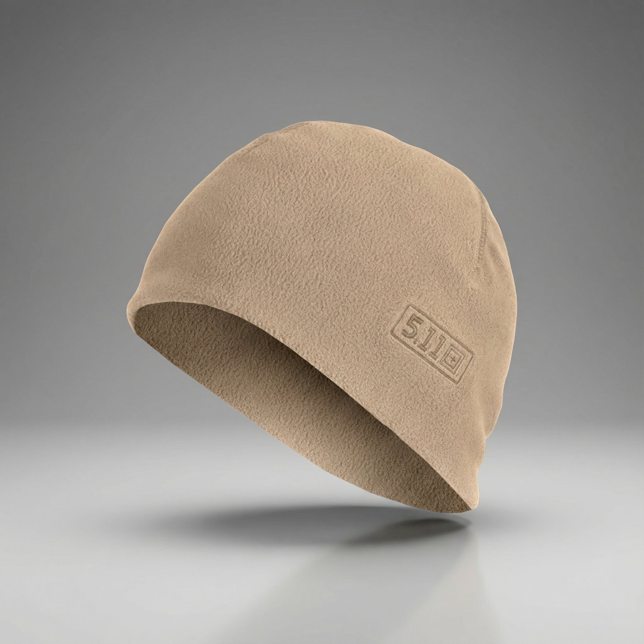 Beige fleece beanie with a brand logo on a gray background