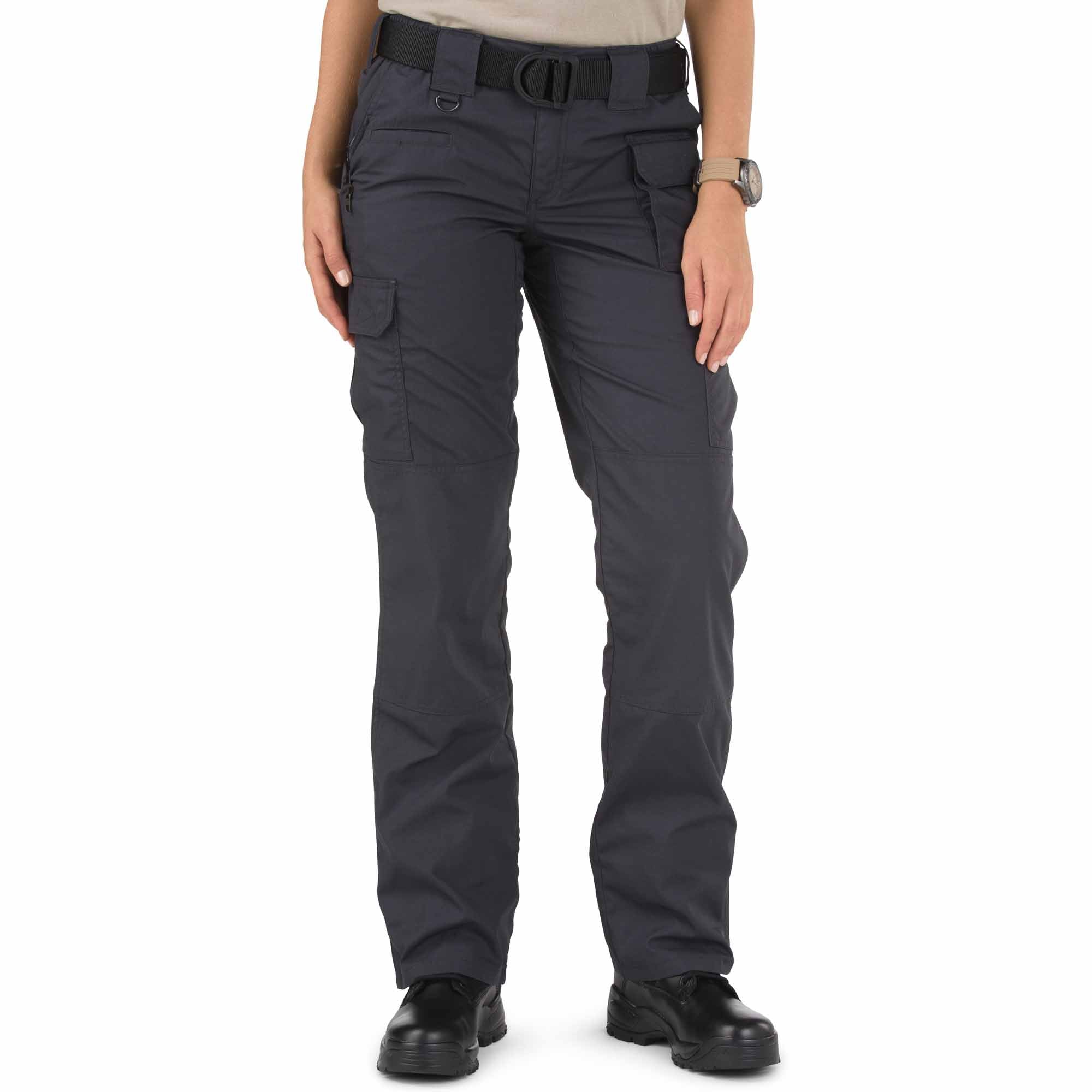 Person wearing dark gray tactical pants on a white background