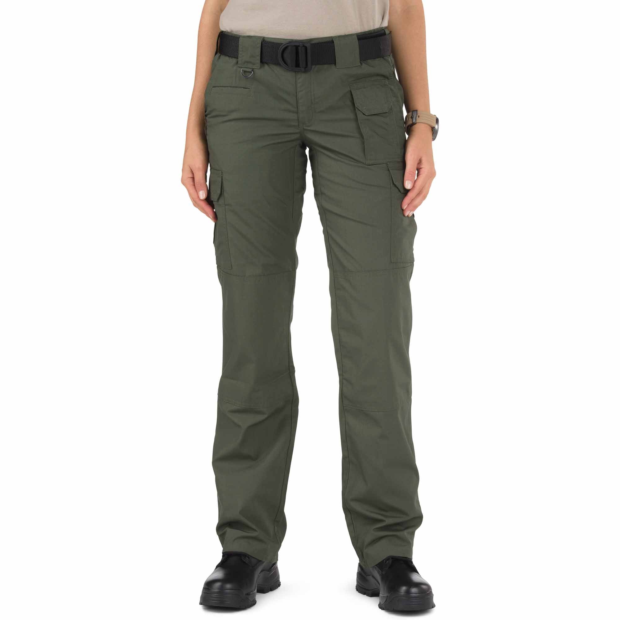 Person wearing green tactical pants on a white background