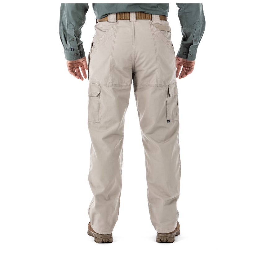 Back view of a person wearing 5.11 Tactical 100% Cotton Canvas Pants in tan, showcasing durability and utility.