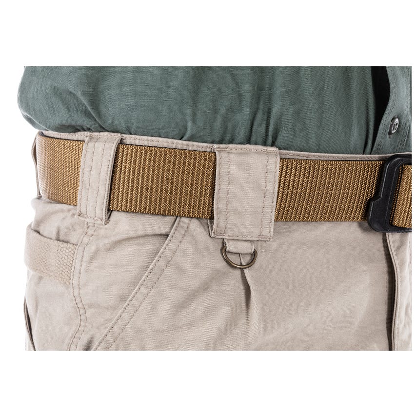 5.11 Tactical Pants detail showing durable belt and waistband design for enhanced utility and comfort in tough environments.