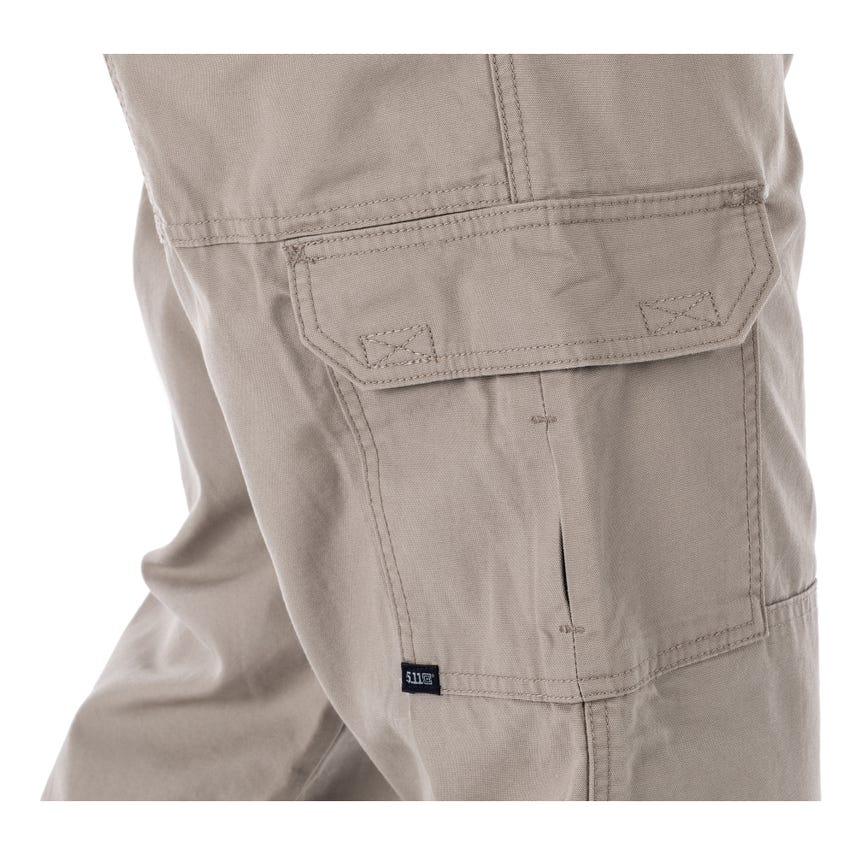 5.11 Tactical 100% cotton canvas tactical pants featuring a utility pocket in khaki color. Durable and functional design.