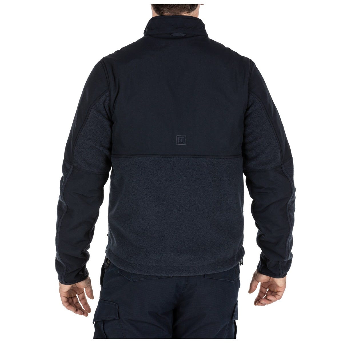Person wearing a black jacket and pants on a white background