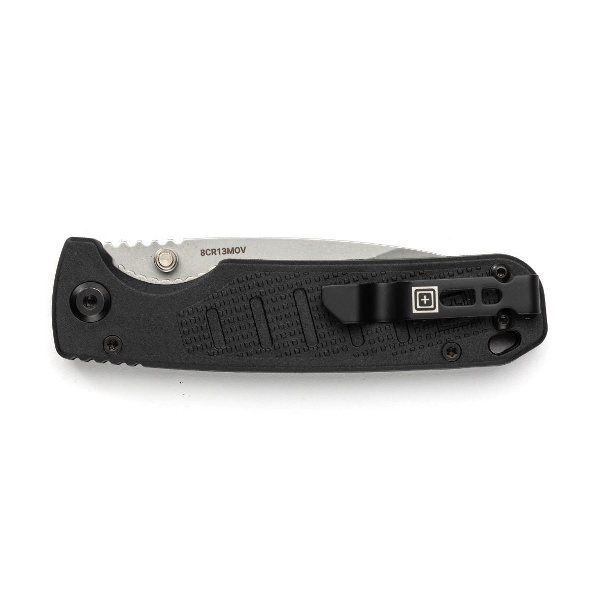 Black closed folding knife on a white background