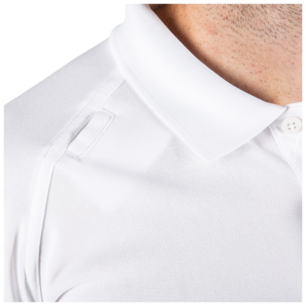 Close-up of a white polo shirt with a collar and button detail.