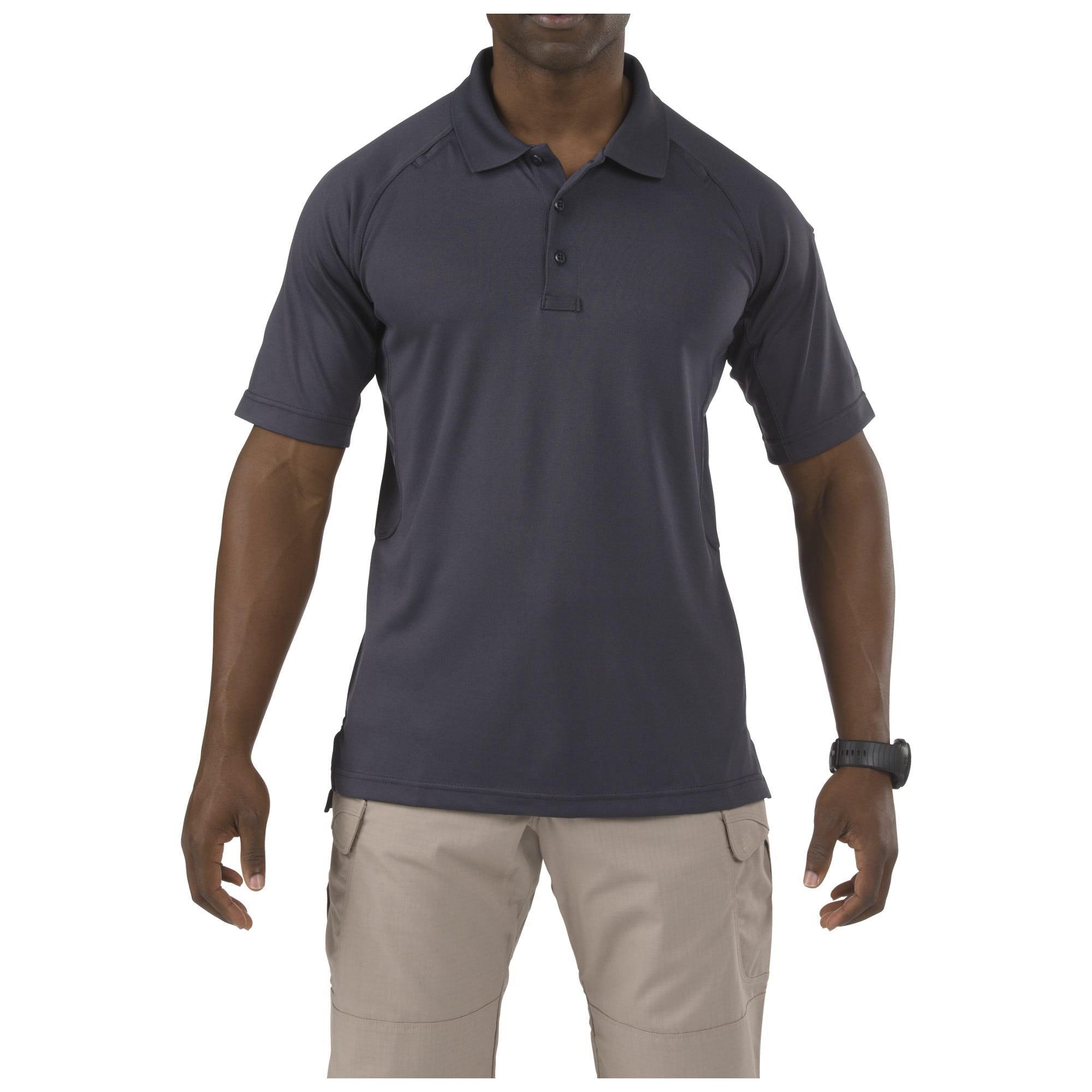 Man wearing a dark gray polo shirt and beige pants on a white background