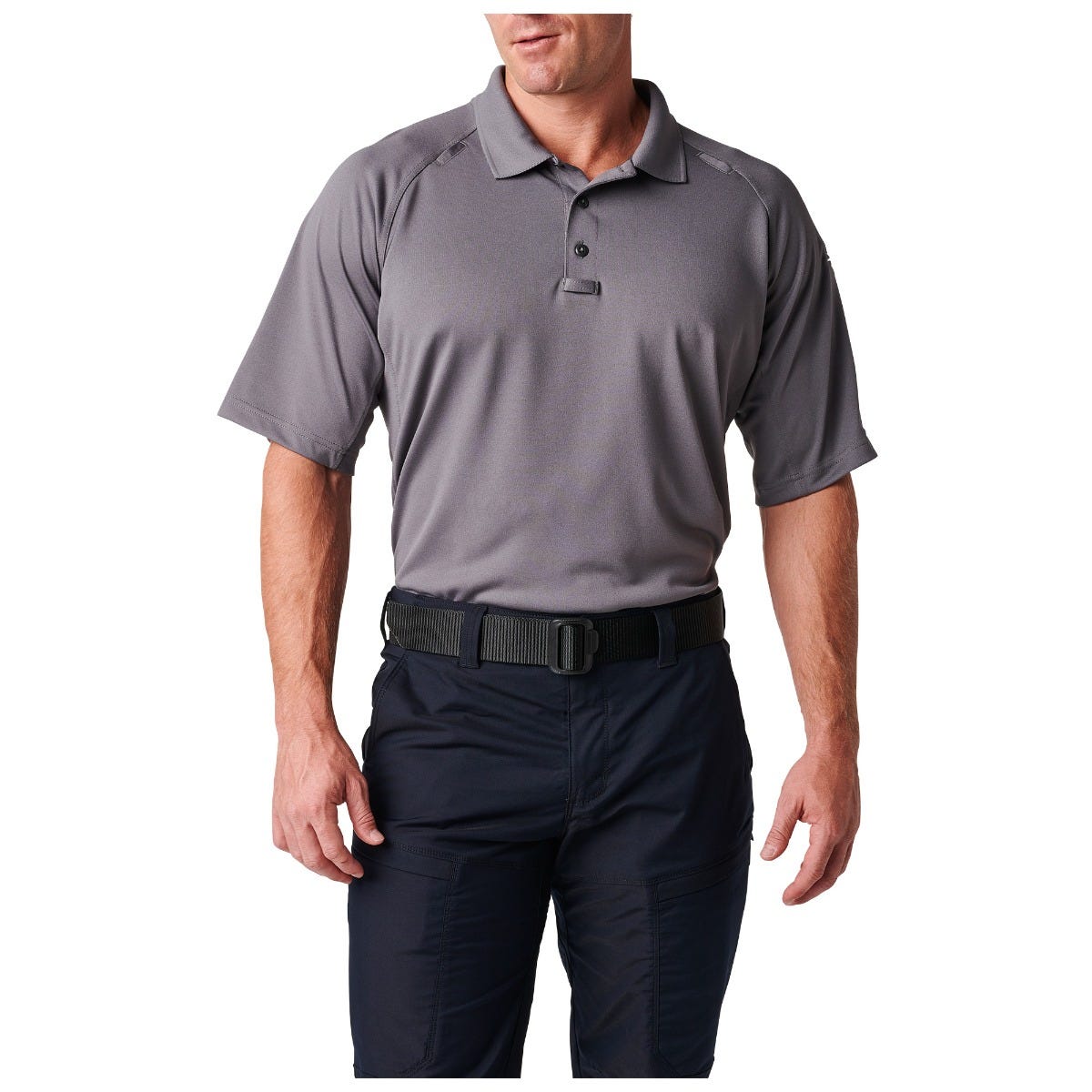 Man wearing a gray polo shirt and black pants on a white background