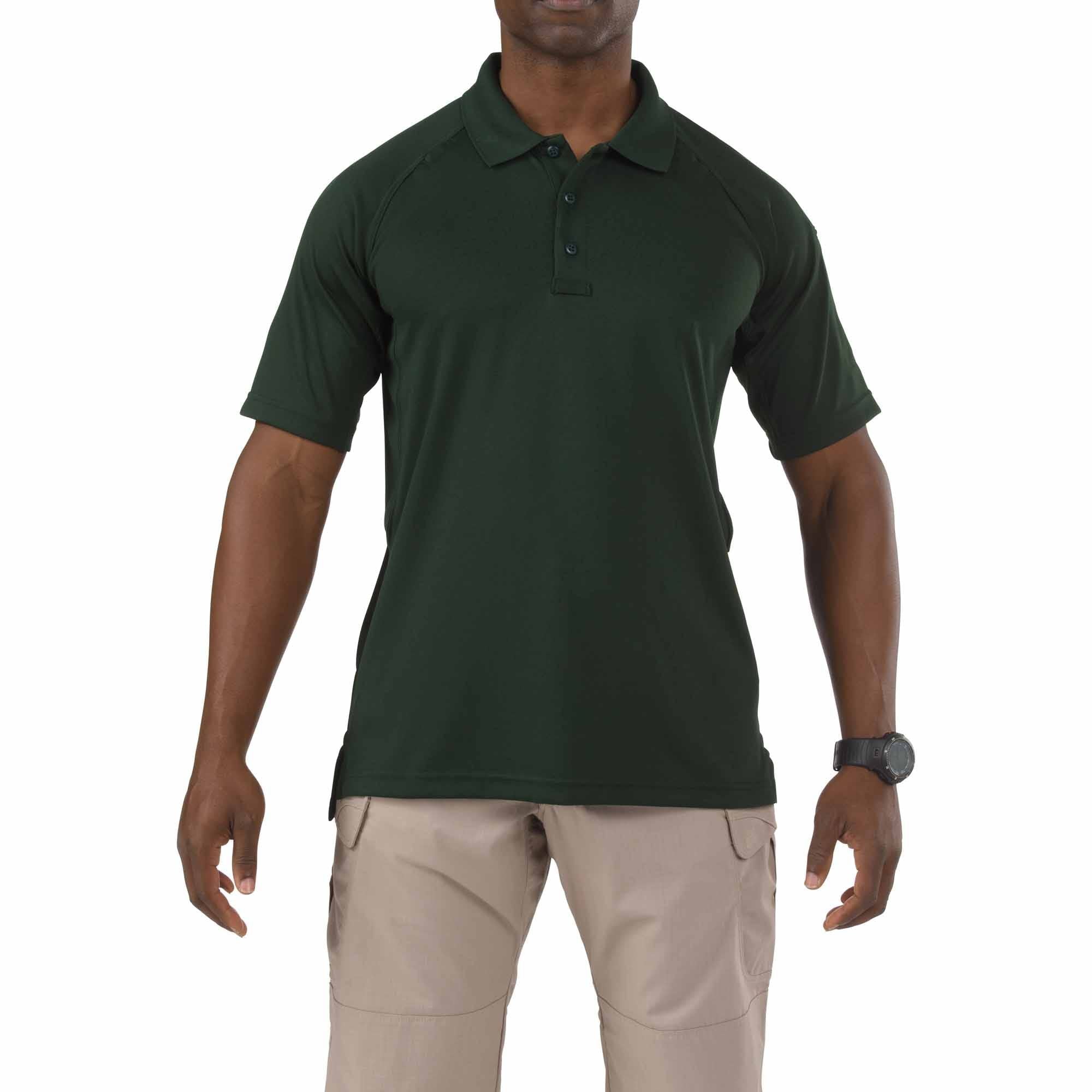 Man wearing a green polo shirt and beige pants on a white background