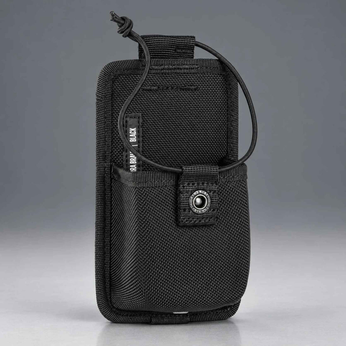 Angled front of the black 5.11 Sierra Bravo radio pouch showing 1680D nylon shell and snap tab