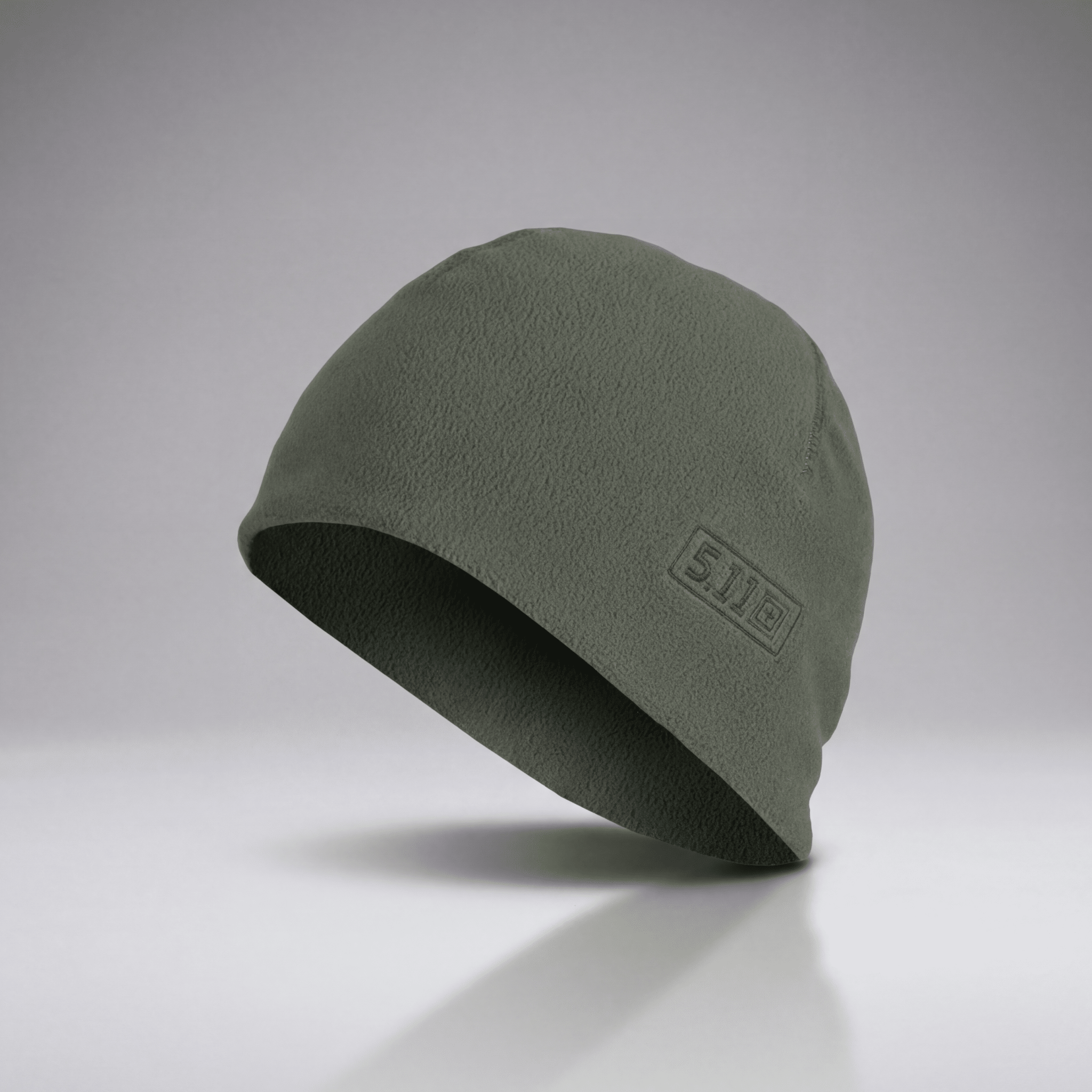 Green beanie with a logo on a gray background