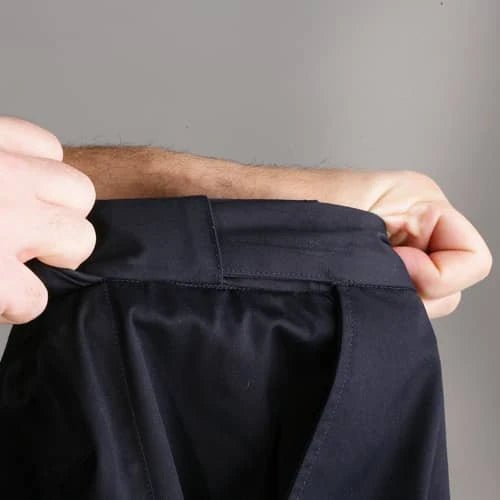 Internal gripper panel inside the waistband that helps keep a uniform shirt tucked in
