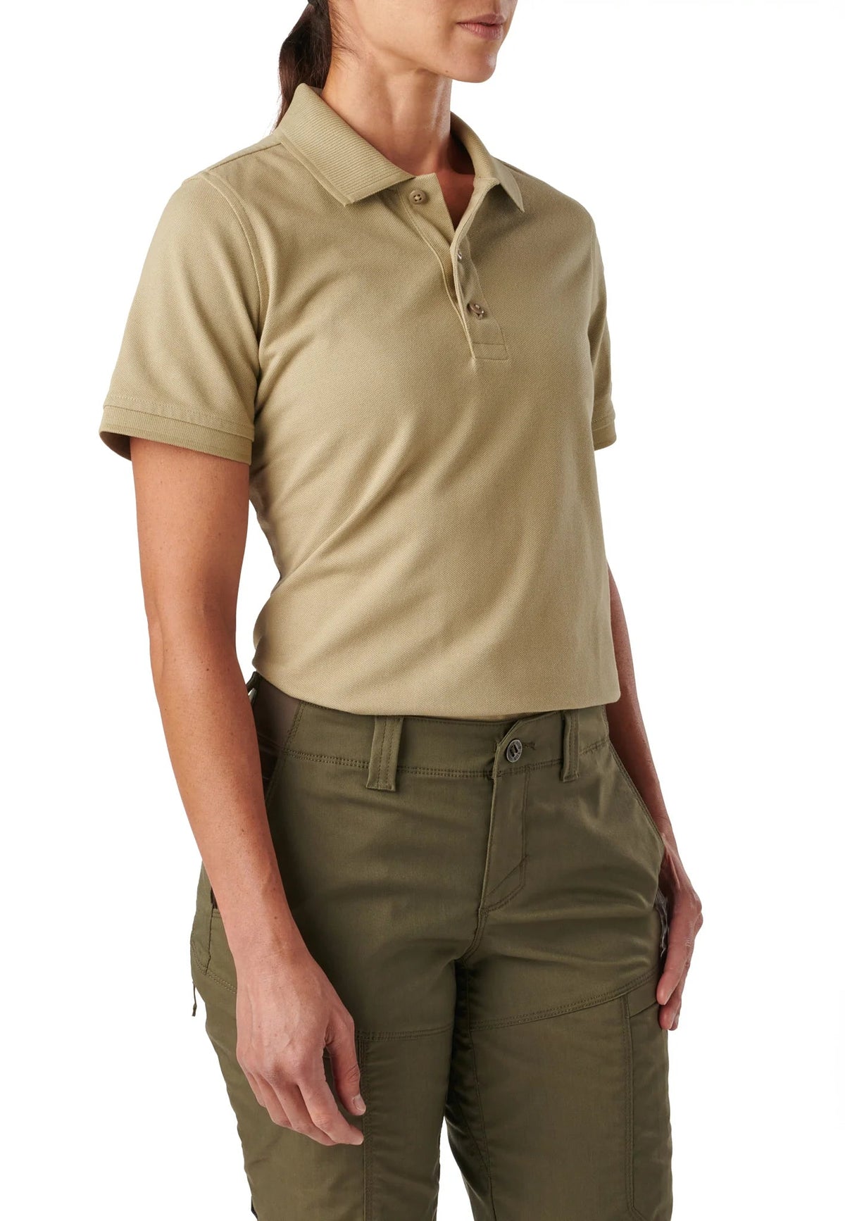 Side view of the 5.11 Women's Professional Polo in Silver Tan worn with olive tactical pants