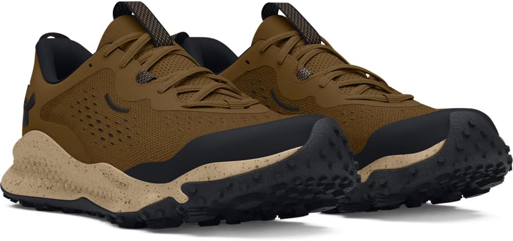 Pair of brown and black hiking shoes on a white background