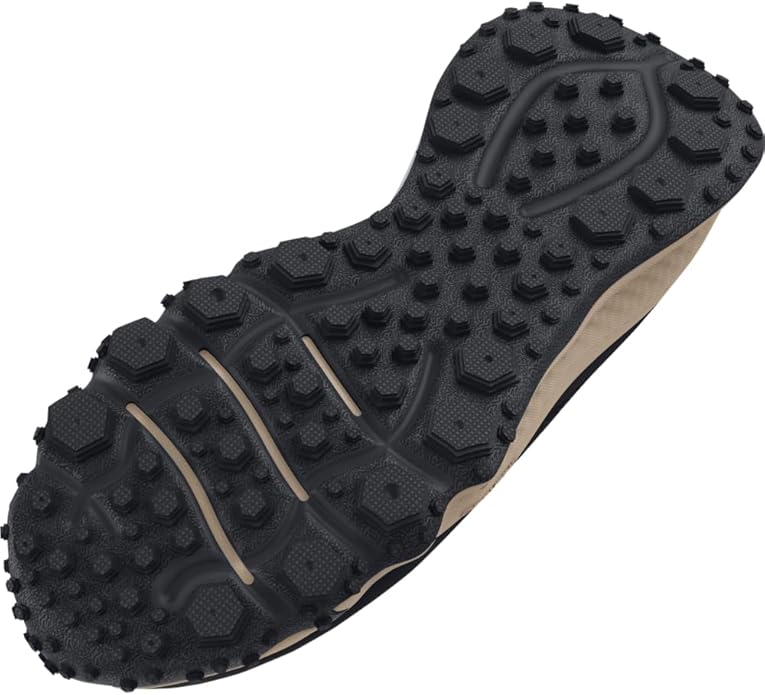 Close-up of a black rubber sole with tread pattern on a white background