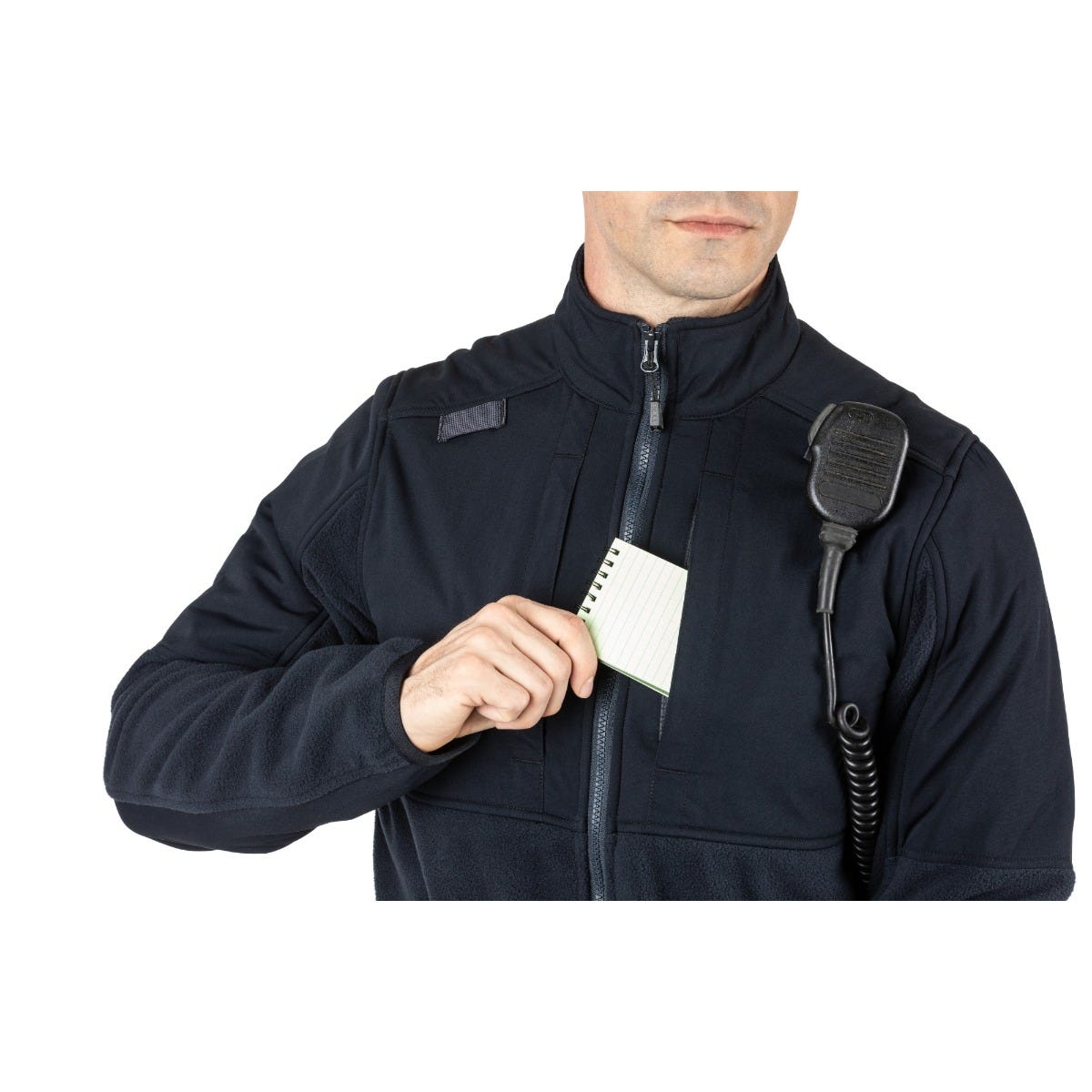 Man wearing 5.11 Tactical Fleece 2.0, reaching for notepad from chest pocket, ready for action in cold weather.