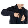 User accessing concealed pocket in 5.11 Tactical Fleece 2.0 for quick access to gear.