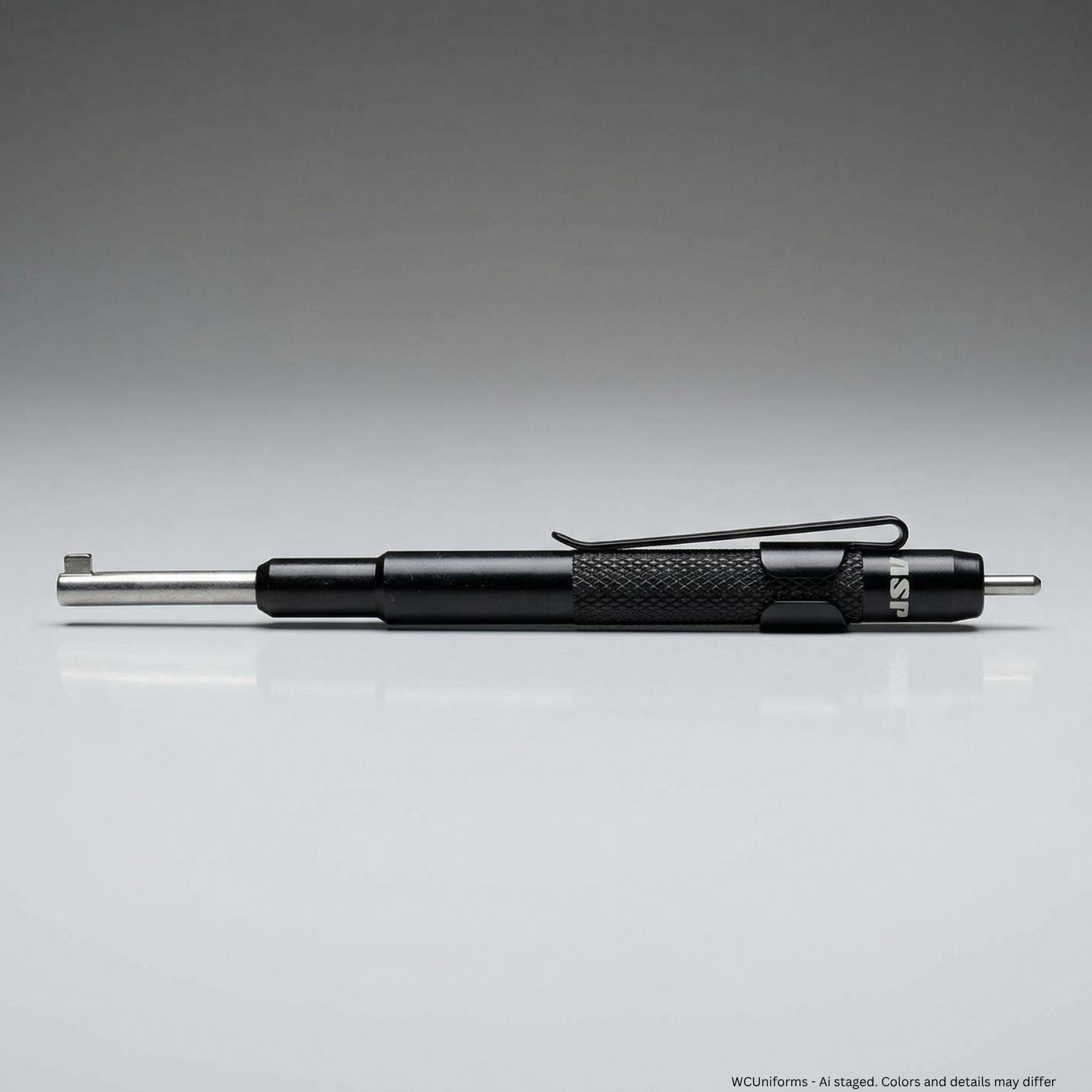 Black handcuff key with metallic clip on a gray background