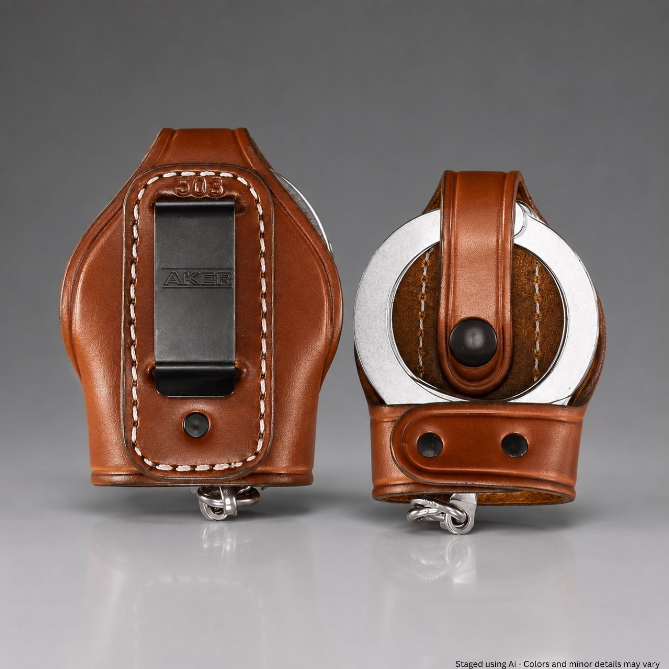 Two brown leather handcuffs on a gray background