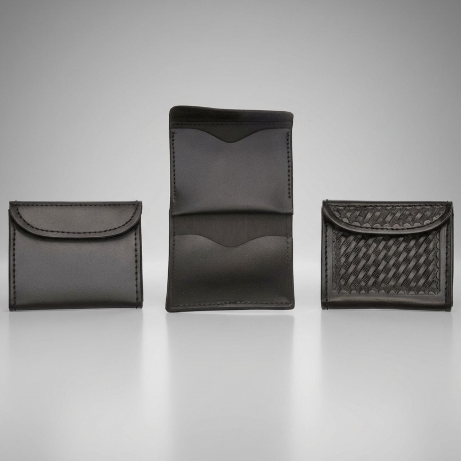 Three black leather disposable glove holders with different patterns on a gray background