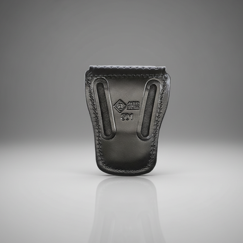 Black leather holster on a reflective surface with a gray background