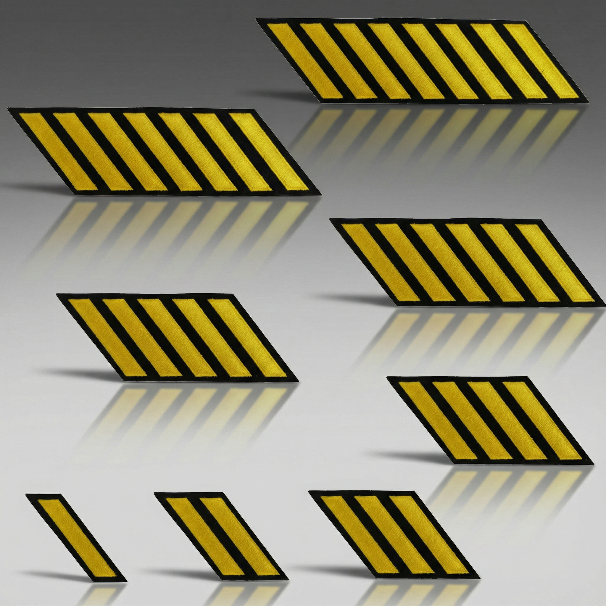 Set of six yellow and black striped warning signs on a reflective surface.
