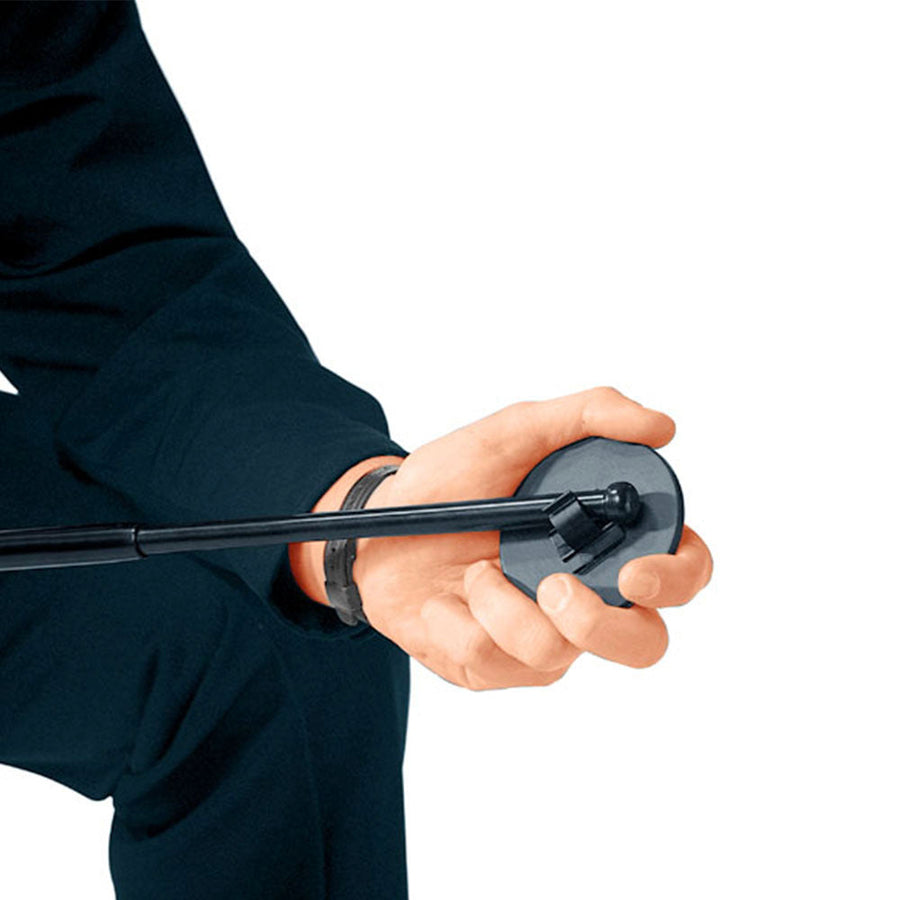 Hand holding a black baton with a circular mirror against a white background