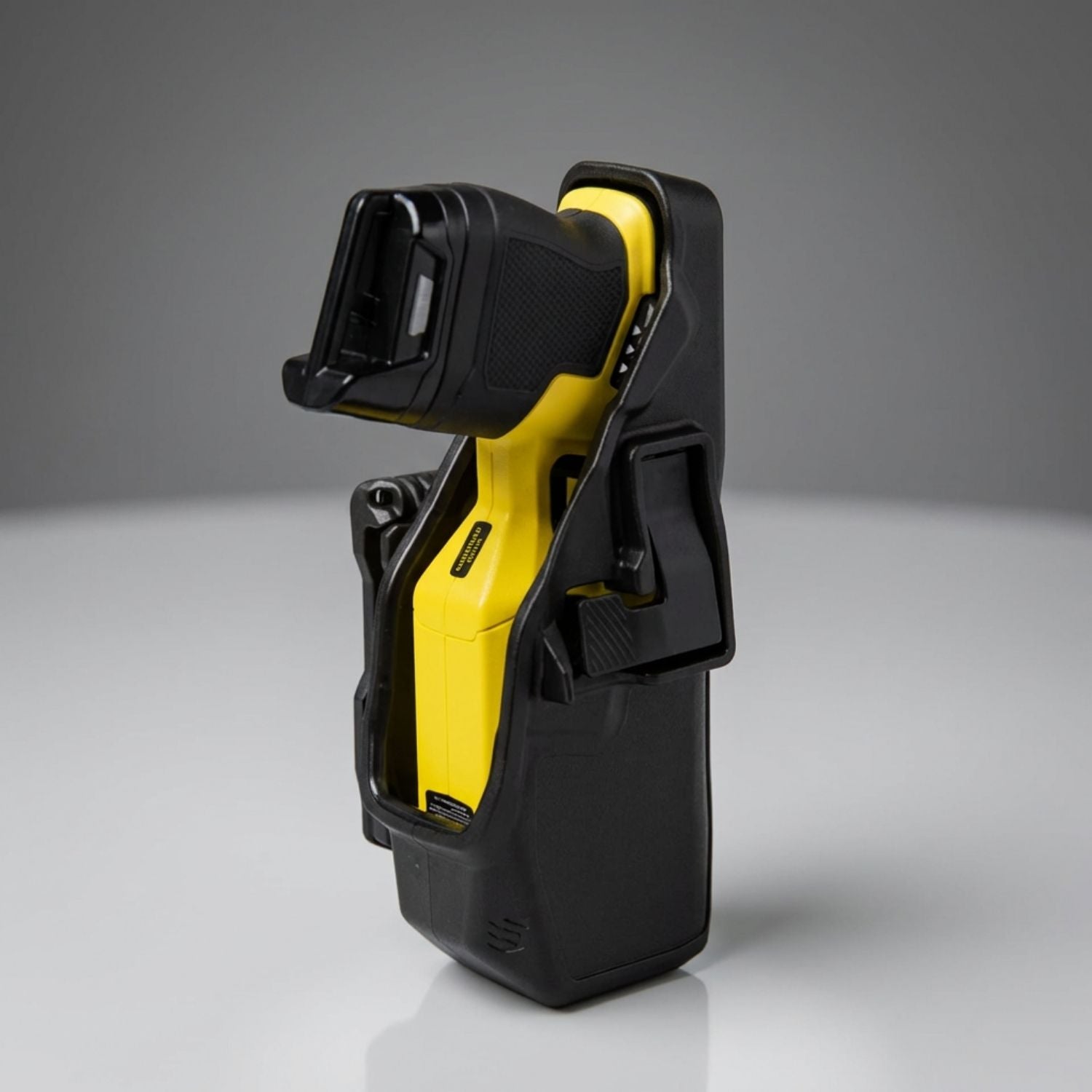 Black Taser 7 holster on a gray background