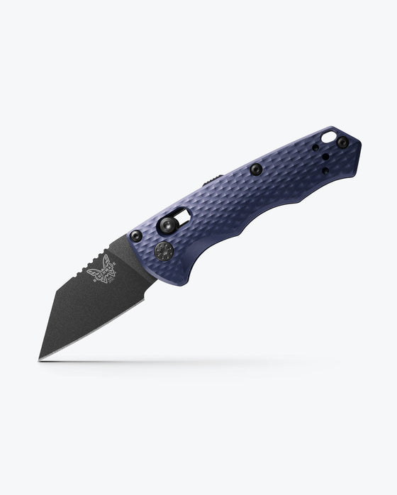 Benchmade Partial Immunity knife in Crater Blue aluminum, showcasing a sub-2-inch CPM-M4 blade with a sleek design.