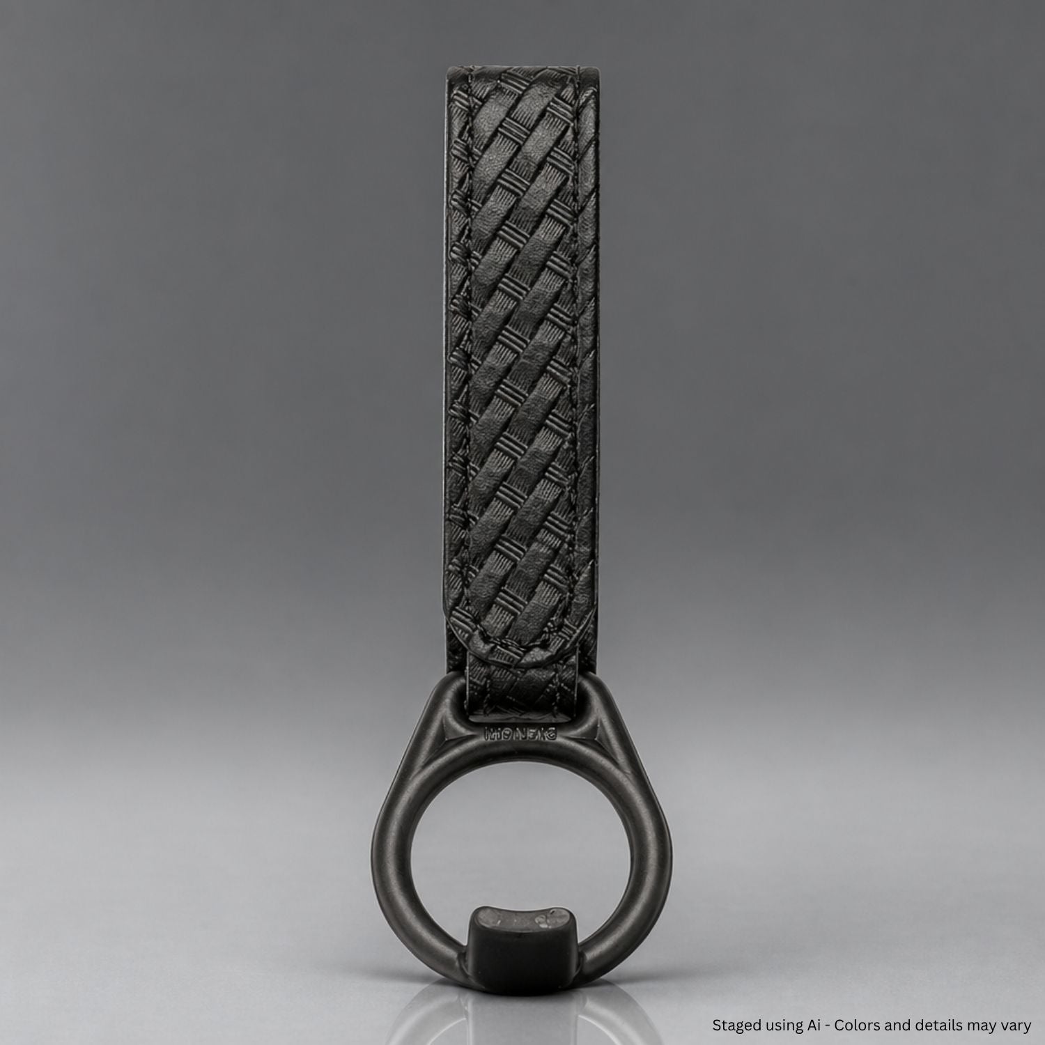 Black basketweave faux leather PR-24 baton ring on a gray background