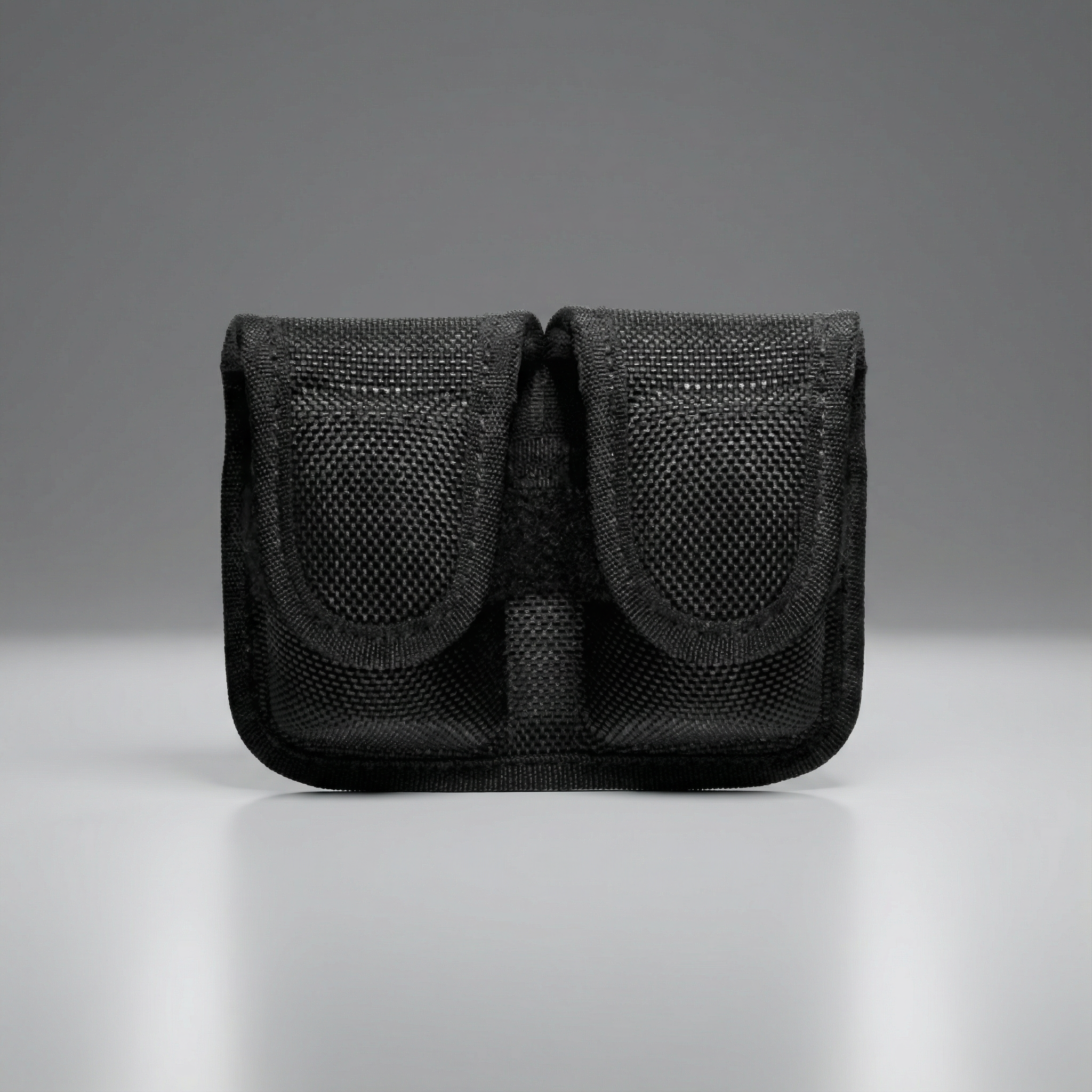 Black Bianchi Model 7301 Speedloader Pouch .38/.357 pouch on a gray background