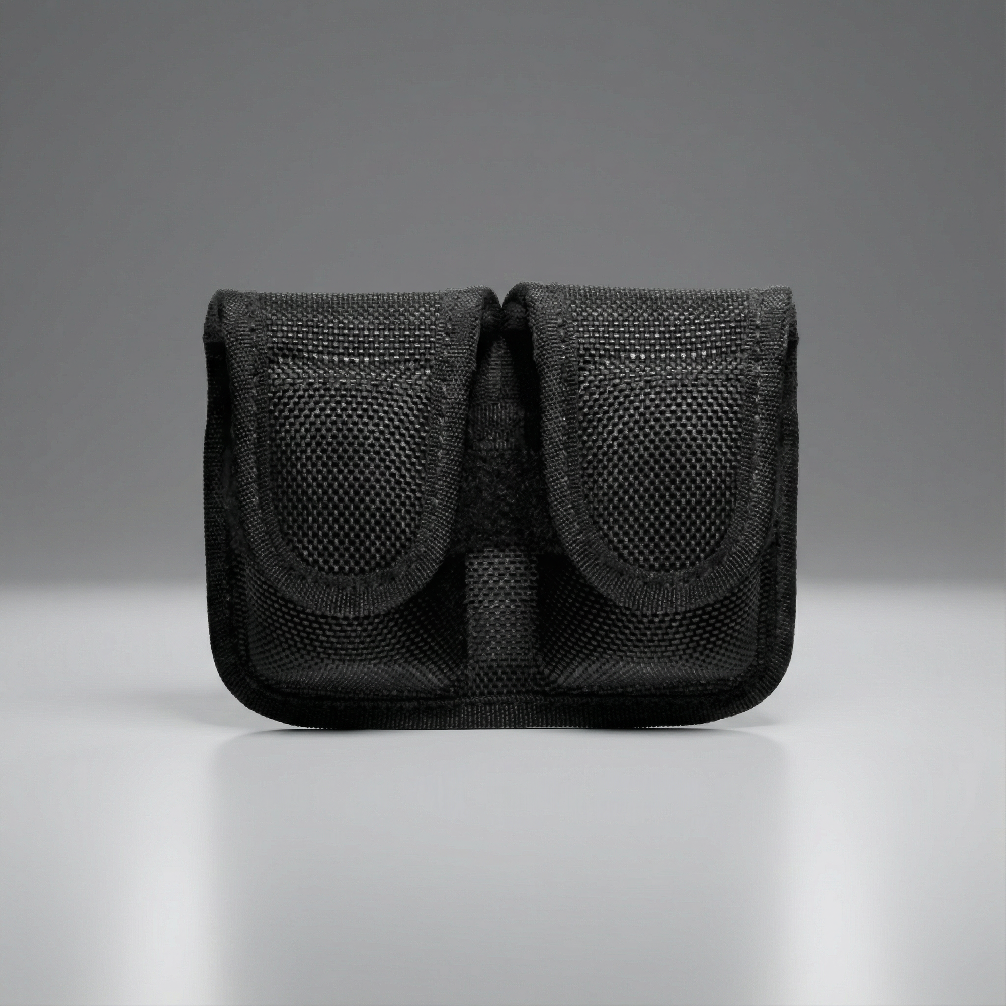 Black Bianchi Model 7301 Speedloader Pouch .38/.357 pouch on a gray background
